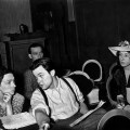 American Actor, writer, producer and director Orson Welles talking with Agnes Moorehead on a theatre stage with members of the Mercury Theatre 1938